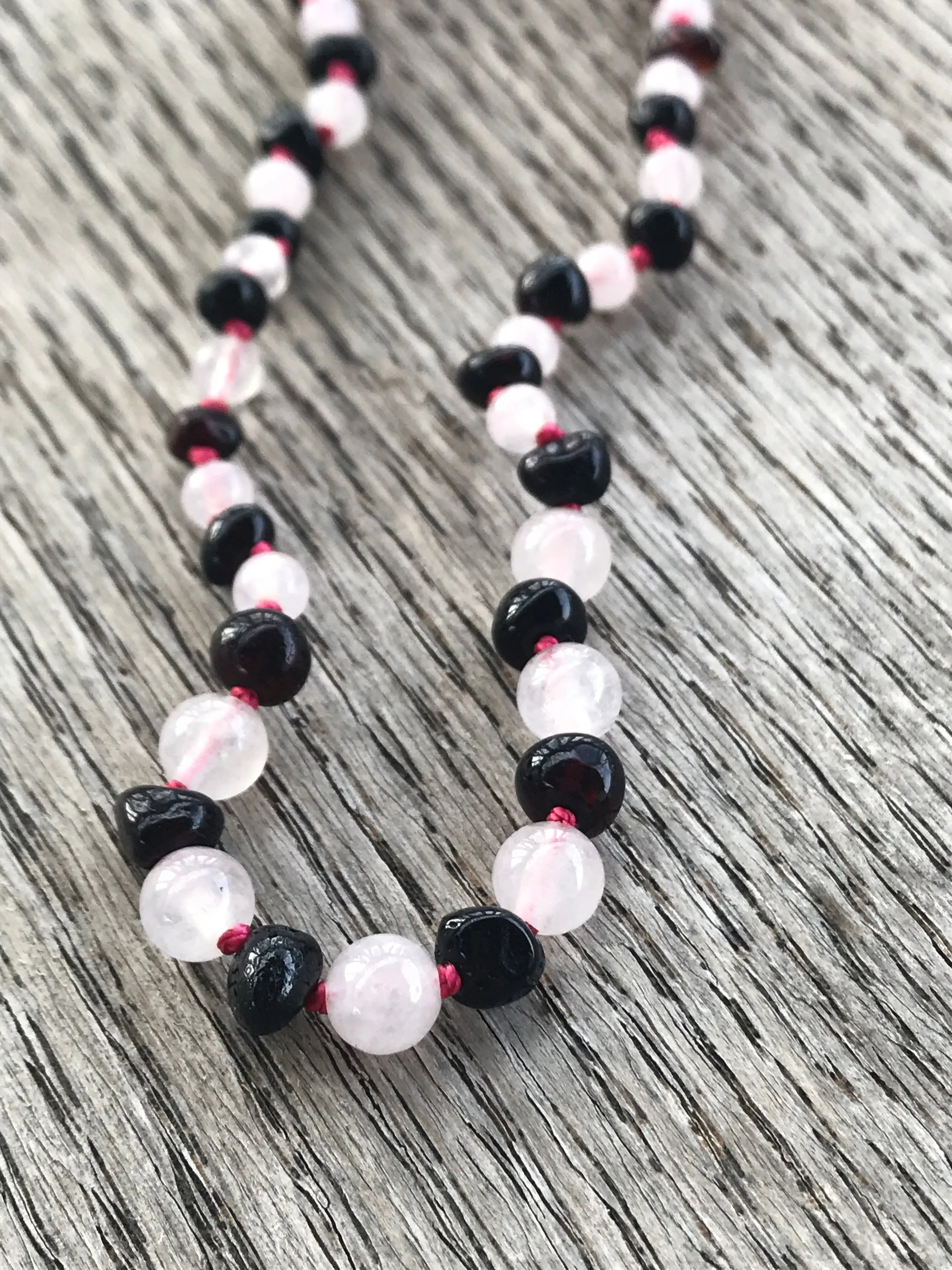 Polished Baltic amber and gemstone teething necklace